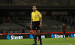 Referee Luis Enrique Santander officiates the match between Pumas de la UNAM and Xolos de...