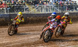 Dan Bewley of Belle Vue Aces in red leads Max Fricke of Leicester Lions in white, Antti Vu...