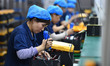 Workers work at a mobile energy storage power production workshop of an electric company i...
