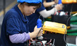 Workers work at a mobile energy storage power production workshop of an electric company i...