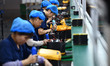 Workers work at a mobile energy storage power production workshop of an electric company i...