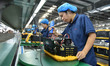 Workers work at a mobile energy storage power production workshop of an electric company i...