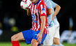 Alexander Sorloth (L) of Atletico de Madrid fights for the ball with Fran Beltran (R) of R...