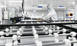Workers at a liquid crystal display manufacturer work at Shanting Economic Development Zon...