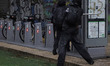 Members of the anarchist Black Bloc carry out direct action while accompanying the mothers...