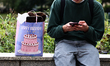 A person uses a phone as a birthday gift bag is seen in Krakow, Poland on September 26, 20...