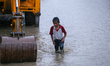 A Nepali boy wades through the flood water in Kathmandu, Nepal, on September 27, 2024. The...