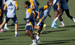 Endrick Felipe Moreira de Sousa (L) and Luka Modric of Real Madrid CF (R) train during the...