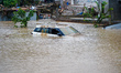 Vehicles are submerged in the flooding of the Nakhu River in Lalitpur, Nepal, on September...