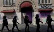 Policewomen guard women marching in Mexico City, Mexico, on September 28, 2024, from the G...