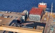 A hull section that will be sent to the final assembly base is loaded onto a semi-submersi...