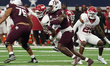 Texas A&M Aggies running back Rueben Owens #8 carries the ball against the Arkansas Razorb...
