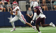 Arkansas Razorbacks quarterback Taylen Green #10 looks for an open receiver to throw the b...