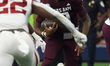 Texas A&M Aggies quarterback Marcel Reed #10 runs ahead against the Arkansas Razorbacks du...