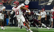 Arkansas Razorbacks quarterback Taylen Green #10 rushes out of the pocket against Texas A&...