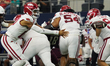Arkansas Razorbacks quarterback Taylen Green #10 pitches the ball against Texas A&M Aggies...