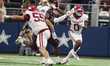Arkansas Razorbacks running back Braylen Russell #0 runs with the ball as he eludes Texas...