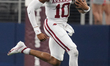 Arkansas Razorbacks quarterback Taylen Green #10 runs for positive yardage against the Tex...