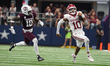 Arkansas Razorbacks quarterback Taylen Green #10 runs for positive yardage against the Tex...