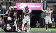 Arkansas Razorbacks defensive lineman Quincy Rhodes Jr. #97 celebrates after making a tack...