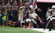 Arkansas Razorbacks running back Ja'Quinden Jackson #22 avoids a tackle by Texas A&M Aggie...