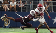 Arkansas Razorbacks running back Ja'Quinden Jackson #22 is tackled by Texas A&M Aggies lin...