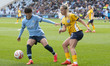 Poppy Pattinson #3 of Brighton & Hove Albion W.F.C. is challenged by Aoba Fujino #20 of Ma...