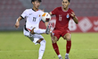 Fairuz Fazli (R) of Singapore battles for the ball with Ho Tung Lam (L) of Hong Kong, Chin...