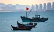 Fishing boats return to the coast of Gujia Island, a new area on the west coast of Qingdao...