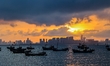 The sunset shines on the beach of Gujia Island in the West Coast New Area of Qingdao, Shan...