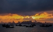The sunset shines on the beach of Gujia Island in the West Coast New Area of Qingdao, Shan...