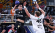 Jacques Pechmalbec of Veszprem HC battles for the ball with Ahmed Abdelhamid of Zamalek Cl...