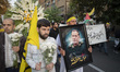 An Iranian protester carries a portrait of Islamic Revolutionary Guard Corps' (IRGC) Quds...