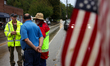 Volunteers collect donations at the Lansing Volunteer Fire Department in Lansing, North Ca...