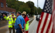 Volunteers collect donations at the Lansing Volunteer Fire Department in Lansing, North Ca...