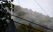 A church steeple rises in front of evening fog in Lansing, North Carolina on September 30,...