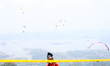A paragliding athlete prepares to take part in a paragliding competition in Sumedang, Indo...