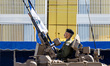 A soldier is seen on a tank in Nicosia, Cyprus, on October 1, 2024. A military parade take...