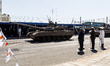 A tank passes in front of the President of Cyprus in Nicosia, Cyprus, on October 1, 2024....