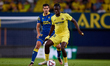 Thierno Barry of Villarreal CF competes for the ball with Alex Munoz of UD Las Palmas duri...