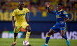 Gueye of Villarreal CF competes for the ball with Dario Cassia Luis Essugo of UD Las Palma...