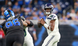 DETROIT, MICHIGAN-SEPTEMBER 30:  Quarterback Geno Smith (7) of the Seattle Seahawks looks...