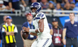 DETROIT, MICHIGAN-SEPTEMBER 30:  Quarterback Geno Smith (7) of the Seattle Seahawks looks...