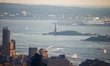 A view on The Statue of Liberty at Liberty Island seen from Top of the Rock NYC Observatio...
