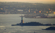 A view on The Statue of Liberty at Liberty Island seen from Top of the Rock NYC Observatio...