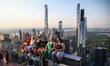 Tourists sit on The Beam recreating  a famous photograph 'Lunch Atop a Skyscraper' by Char...