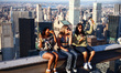 Tourists sit on The Beam recreating  a famous photograph 'Lunch Atop a Skyscraper' by Char...