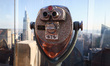 A telescope at the Top of the Rock NYC Observation Deck of Rockefeller Center building in...