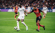 Tammy Abraham of AC Milan and Jonathan Tah of Bayer 04 Leverkusen are in action during the...