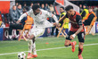 Emerson of AC Milan and Piero Hincapie of Bayer 04 Leverkusen are in action during the UEF...
